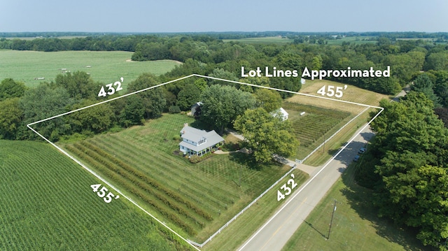 birds eye view of property with a rural view