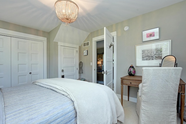 bedroom with carpet and an inviting chandelier