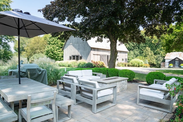 view of patio / terrace with a grill and an outdoor living space