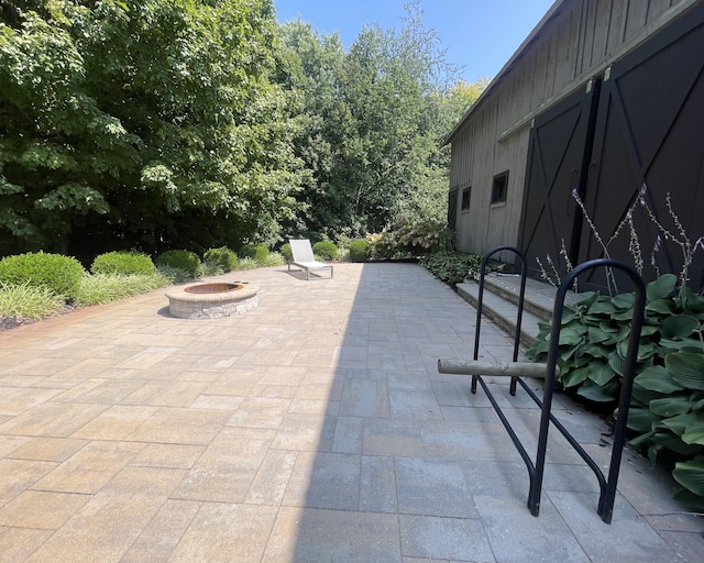 view of patio / terrace with a fire pit