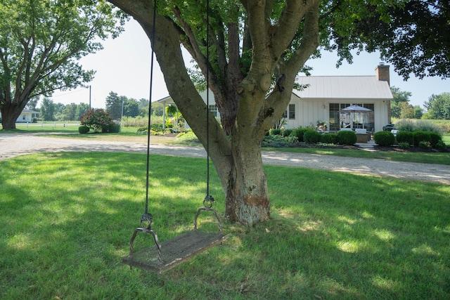 view of yard featuring covered porch