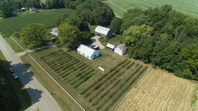 birds eye view of property with a rural view