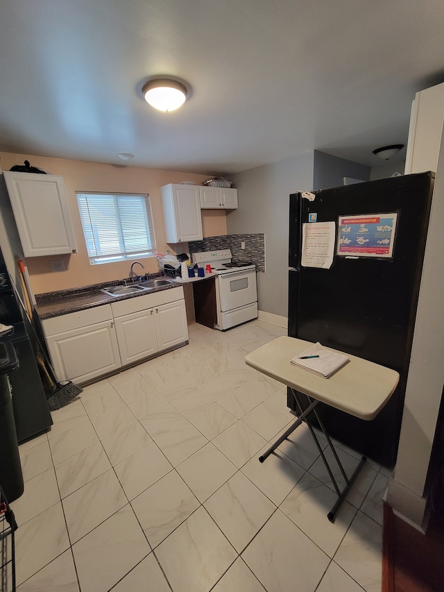 kitchen featuring electric stove, light tile patterned floors, white cabinets, backsplash, and sink