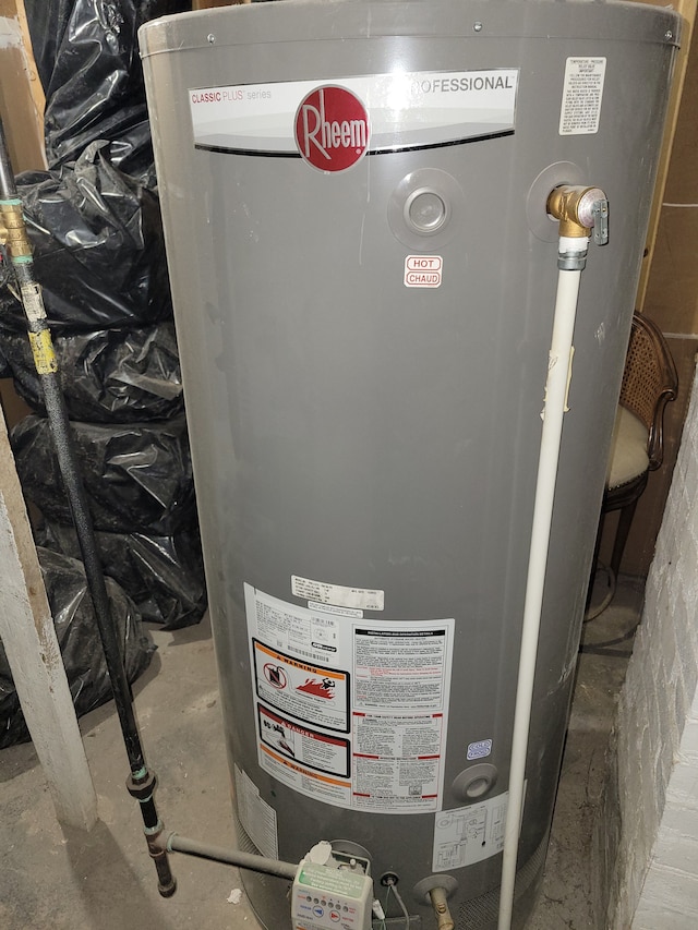 utility room featuring water heater