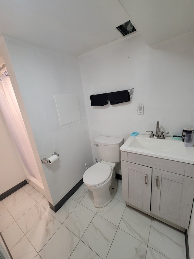 bathroom with toilet and vanity