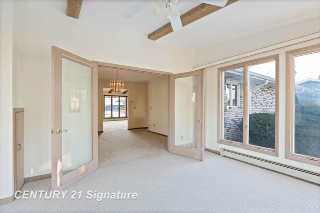 carpeted spare room featuring french doors, beamed ceiling, a baseboard radiator, and ceiling fan with notable chandelier