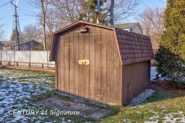 snow covered structure featuring a yard