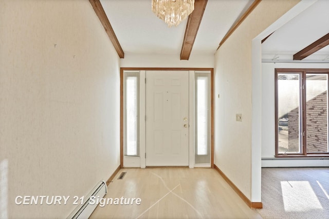 entrance foyer with beam ceiling, plenty of natural light, and a notable chandelier