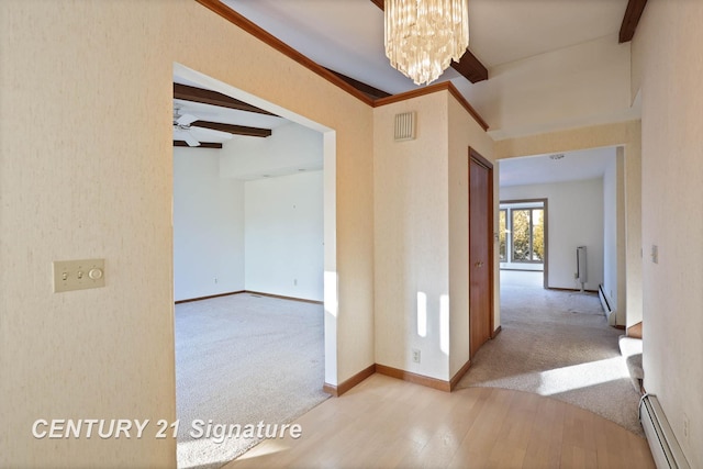 corridor featuring beam ceiling, an inviting chandelier, light colored carpet, and a baseboard heating unit