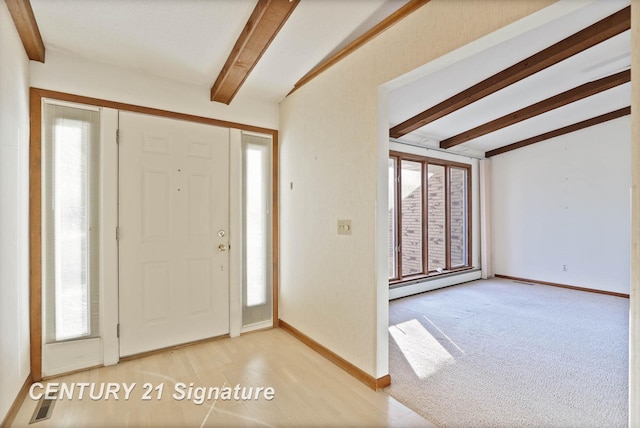 carpeted foyer entrance with beam ceiling, a baseboard radiator, and a healthy amount of sunlight