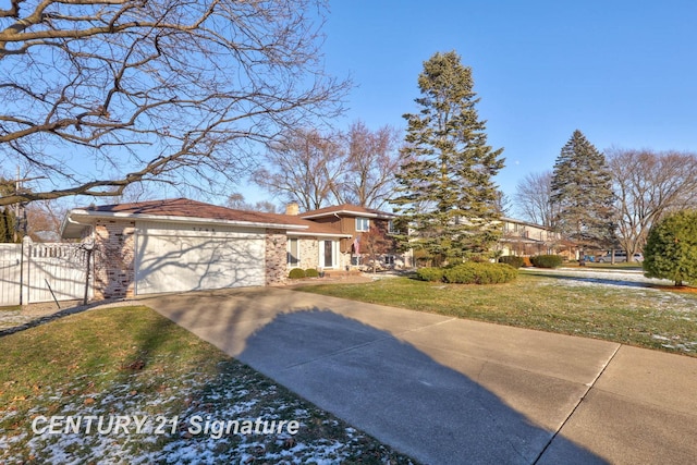 view of front of house with a front yard and a garage