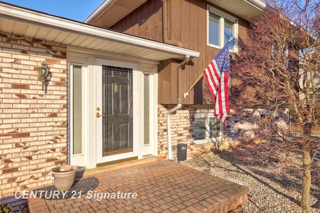 property entrance featuring a patio