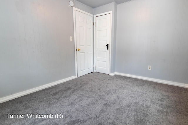 unfurnished room featuring carpet flooring