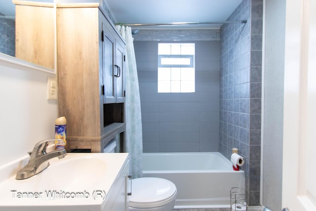 full bathroom with toilet, vanity, and shower / bath combination with curtain