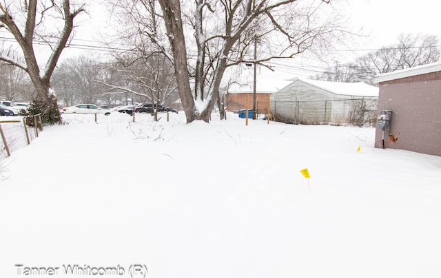 view of yard covered in snow