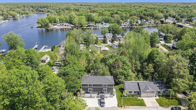 16905 Highland Ave, Spring Lake, MI 49456 - aerial perspective of suburban area featuring a forest and a nearby body of water
