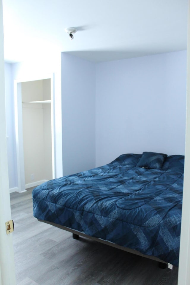 8142 W 32nd Rd, Harrietta, MI 49638 - bedroom featuring wood finished floors