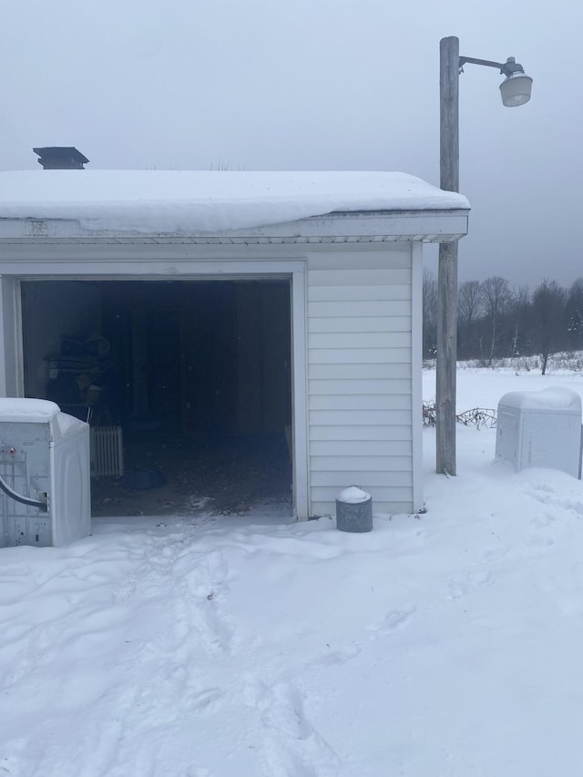 8142 W 32nd Rd, Harrietta, MI 49638 - view of snow covered garage