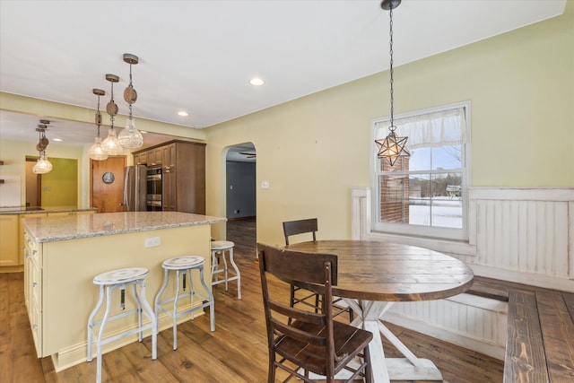 dining space with hardwood / wood-style floors