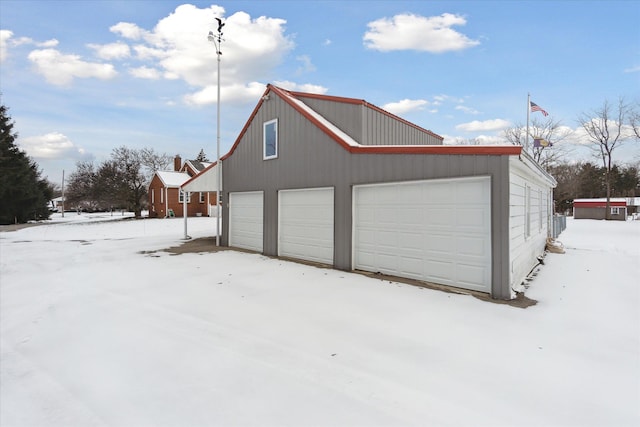 view of snow covered garage