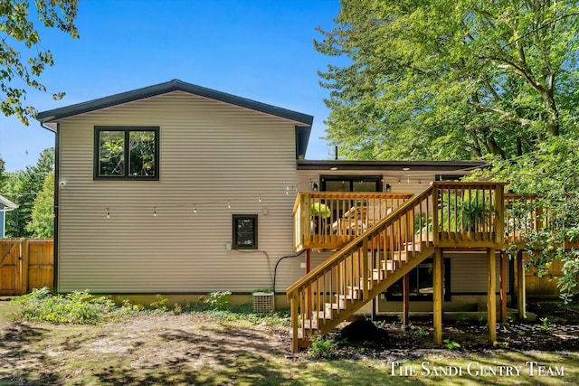 rear view of property with a wooden deck