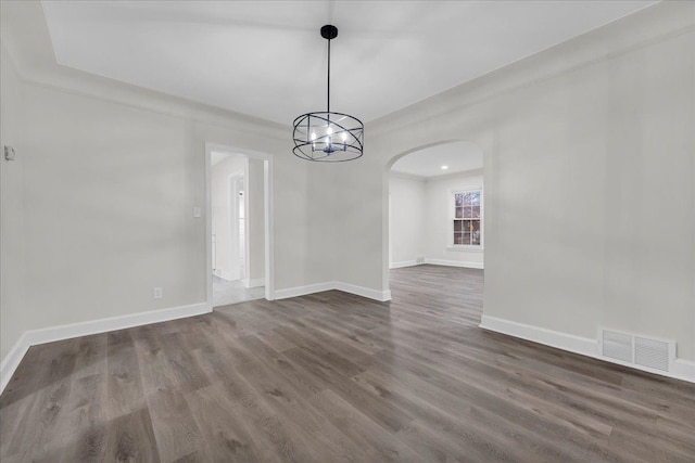 unfurnished room featuring dark wood-type flooring