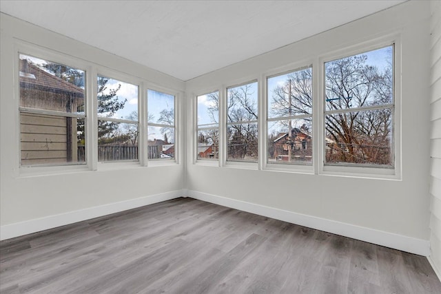 unfurnished sunroom with a wealth of natural light