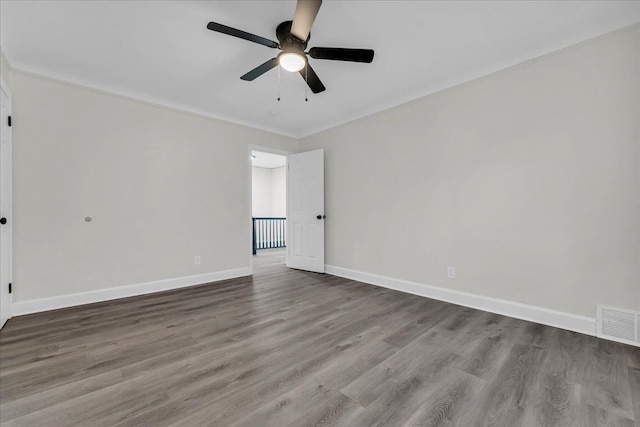 spare room featuring ceiling fan and hardwood / wood-style floors