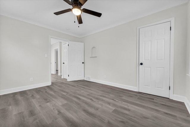 spare room featuring hardwood / wood-style flooring and ceiling fan