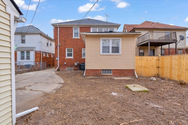 back of property featuring central AC unit