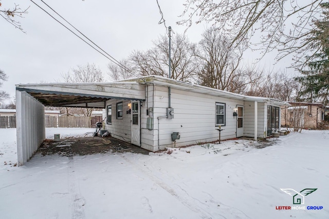 view of front facade with a carport