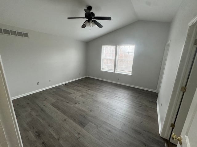 empty room with dark hardwood / wood-style floors, ceiling fan, and lofted ceiling