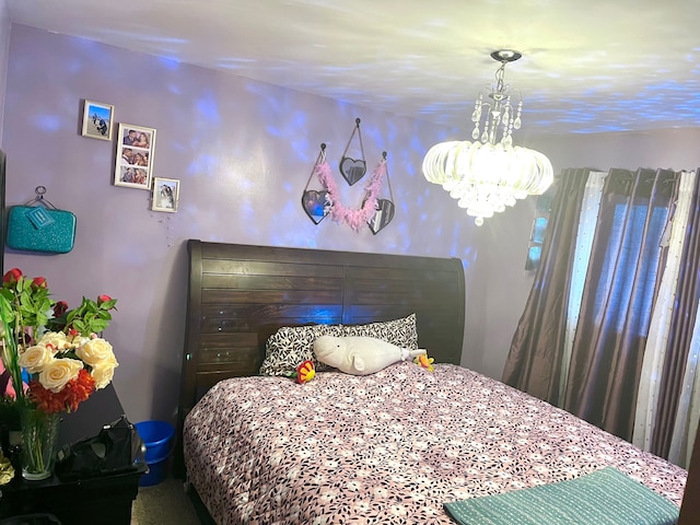 bedroom with a notable chandelier