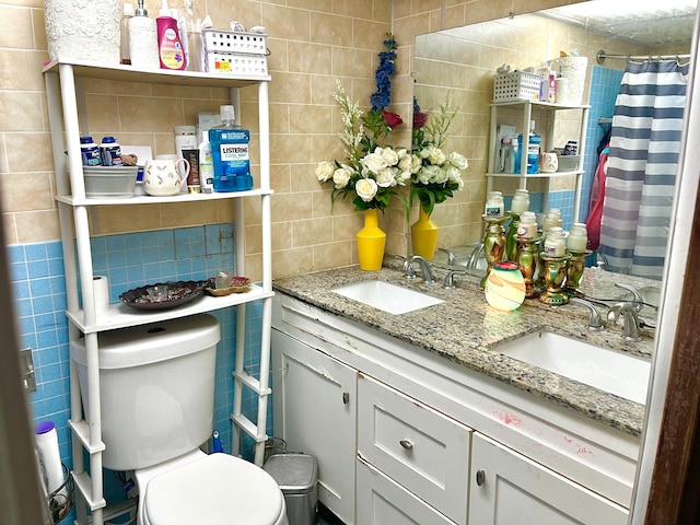 bathroom featuring walk in shower, tasteful backsplash, toilet, vanity, and tile walls