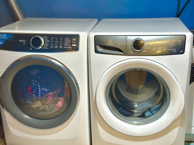 washroom with separate washer and dryer