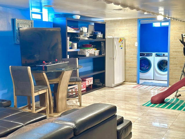 playroom with washing machine and clothes dryer