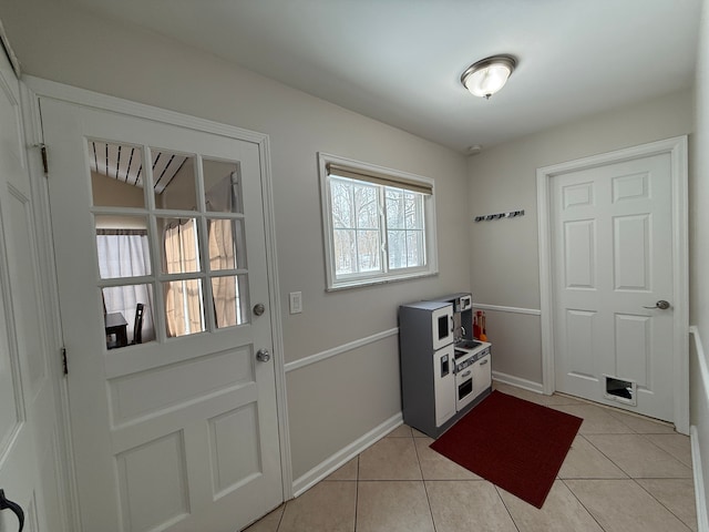 entryway featuring light tile patterned floors