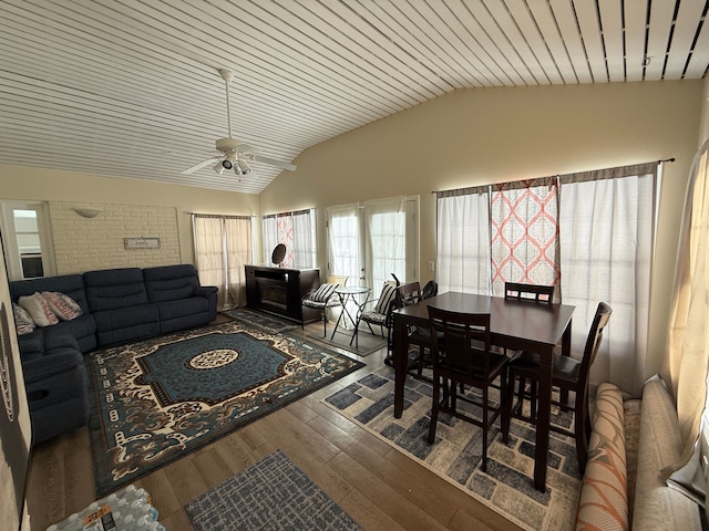 dining room with dark hardwood / wood-style flooring, wooden ceiling, ceiling fan, and lofted ceiling