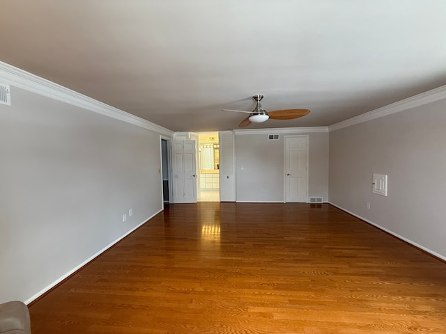 unfurnished room with wood-type flooring, ceiling fan, and crown molding