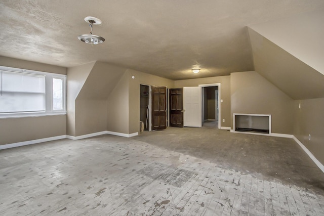 additional living space featuring vaulted ceiling