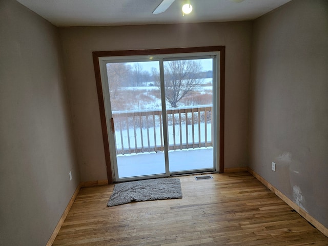 entryway featuring ceiling fan and light hardwood / wood-style flooring