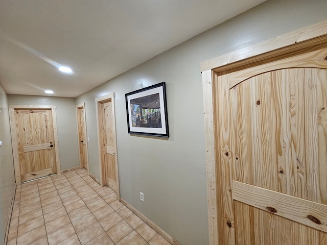 hallway featuring light tile patterned floors