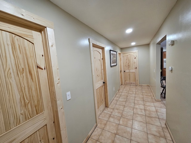 corridor featuring light tile patterned flooring