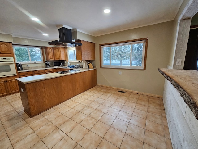 kitchen with range hood, kitchen peninsula, oven, black electric cooktop, and light tile patterned floors