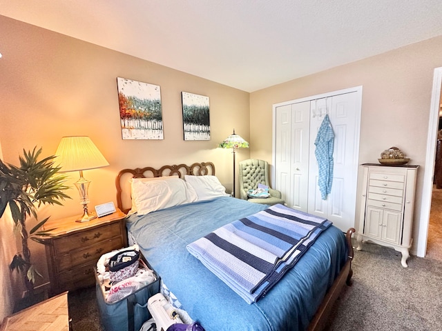 carpeted bedroom featuring a closet