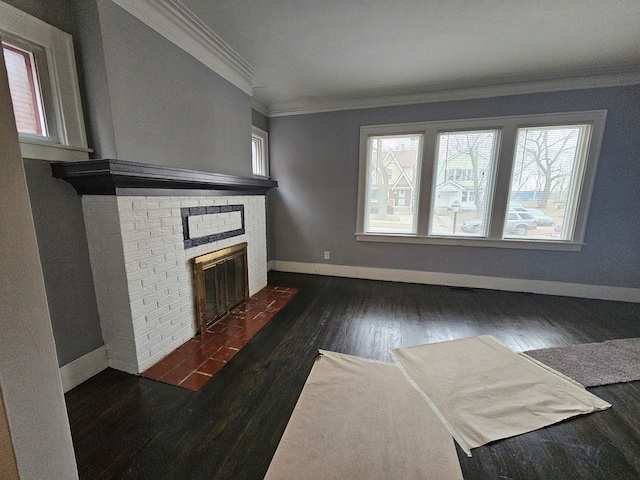 living room with crown molding, a fireplace, and dark wood-type flooring