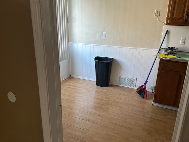 unfurnished room featuring light hardwood / wood-style floors