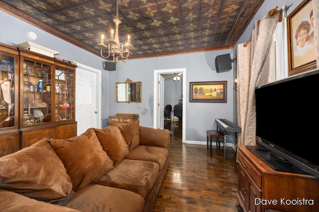 living room featuring ornamental molding, a notable chandelier, and dark hardwood / wood-style flooring