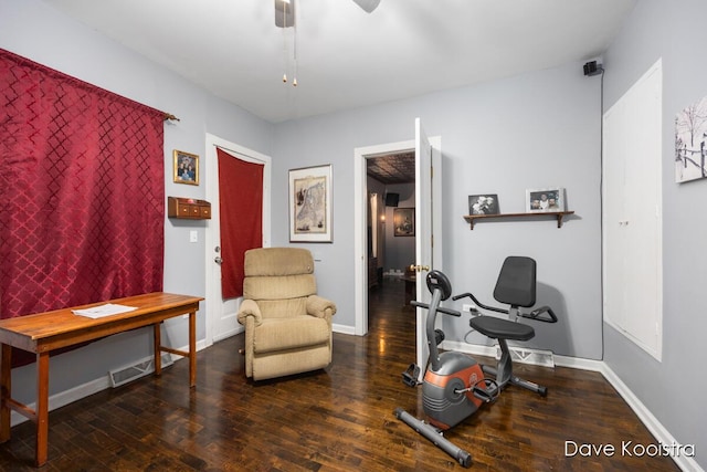 workout area with dark hardwood / wood-style flooring and ceiling fan