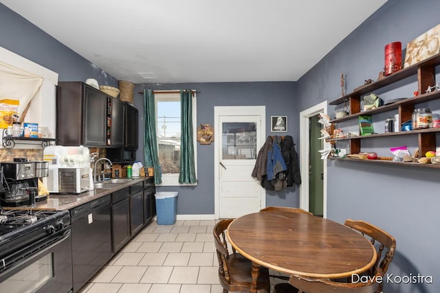 kitchen featuring black appliances, light tile patterned flooring, sink, and dark brown cabinetry